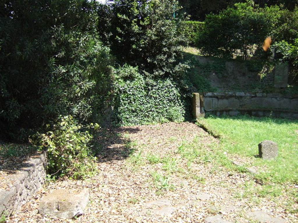 Via di Nola. May 2006.Looking east along its continuation between the tombs at the Nola Gate and into the unexcavated area. 
