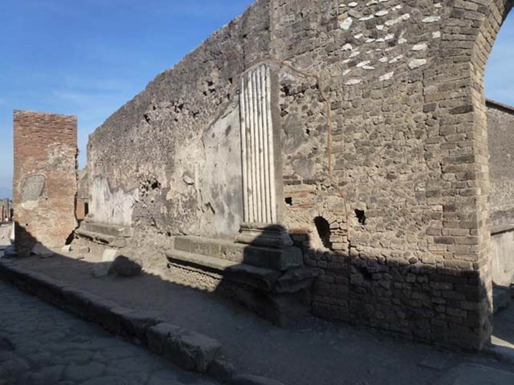 Vicolo dei Soprastanti, south side, June 2012. Looking east along VII.8, wall and entrances of the Forum. Photo courtesy of Michael Binns.
