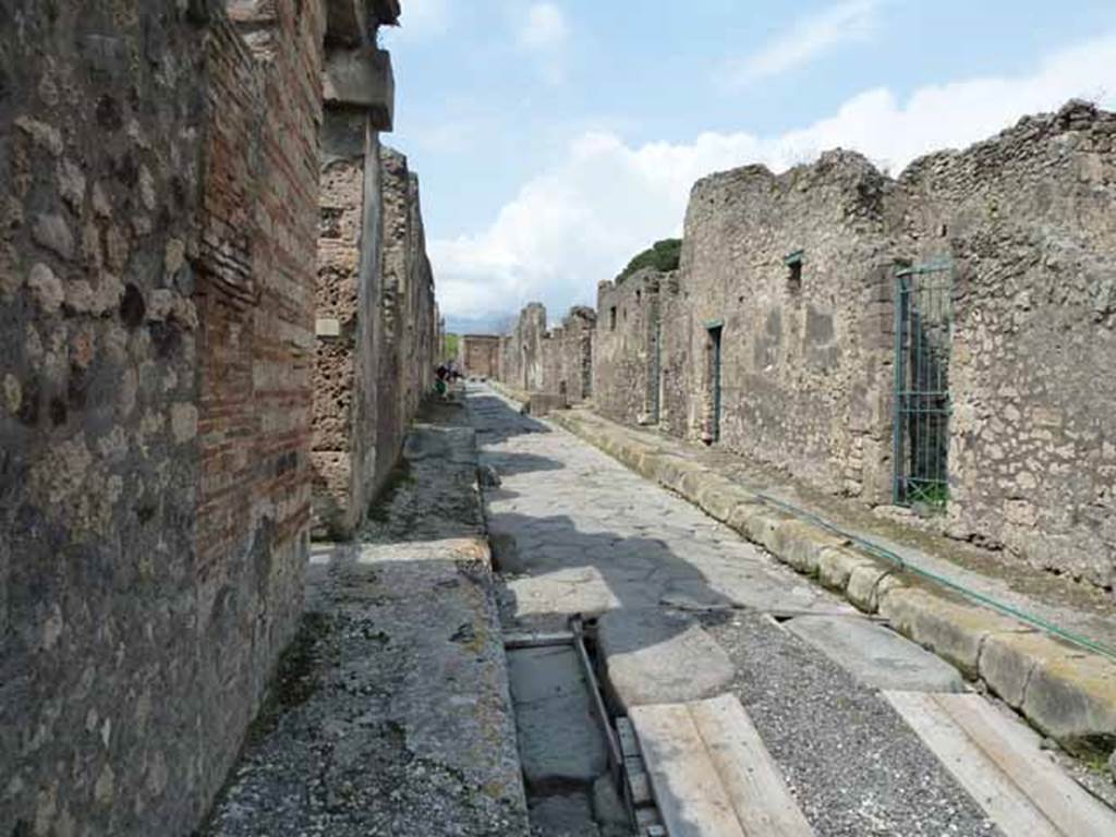 Vicolo dei Vettii, May 2010. Looking north between VI.15 and VI.16, from near VI.15.5.