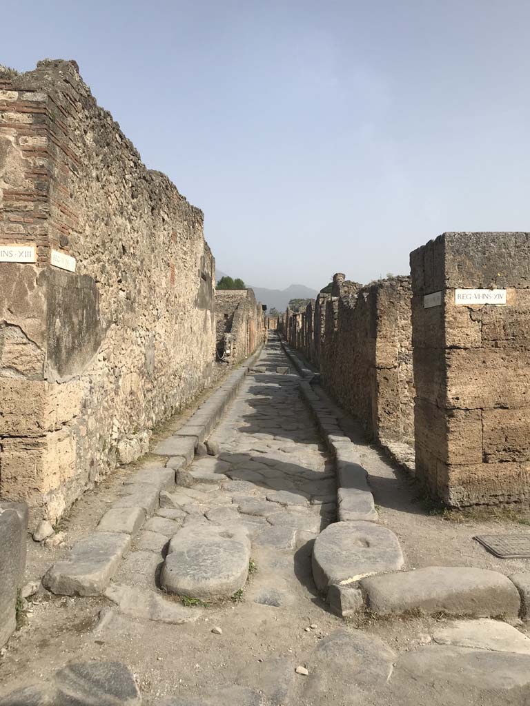 Vicolo dei Vettii between VI.13 and VI.14. April 2019. Looking north from Via della Fortuna. 
Photo courtesy of Rick Bauer.
