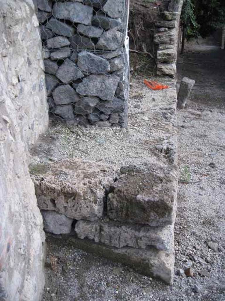 Vicolo del Citarista, Pompeii. September 2010. Restored south-west side of insula 19, with its junction with unexcavated insula to the south. On the right of the picture is Vicolo del Citarista, at its junction with Vicolo del Conciapelle. Photo courtesy of Drew Baker.
