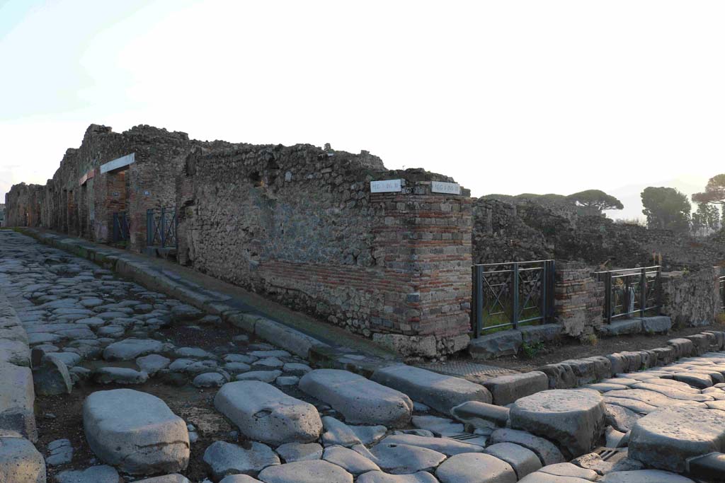 Vicolo del Menandro, south side. December 2018. Looking east from junction with Via Stabiana, with I.3.12, on corner. Photo courtesy of Aude Durand.