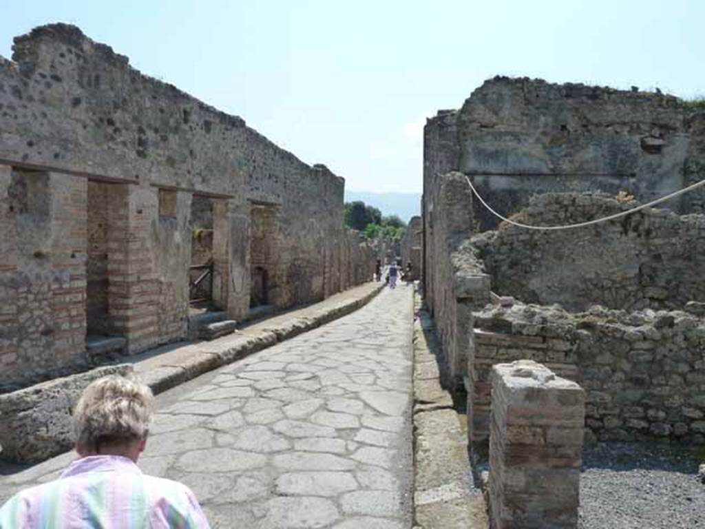 Vicolo della Maschera, May 2010. Looking south between VII.11 and VII.10.