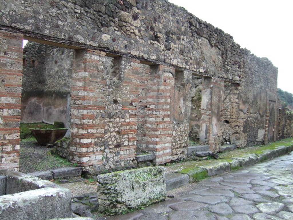 Vicolo della Maschera, east side. December 2005. Looking south from VII.11.5. 