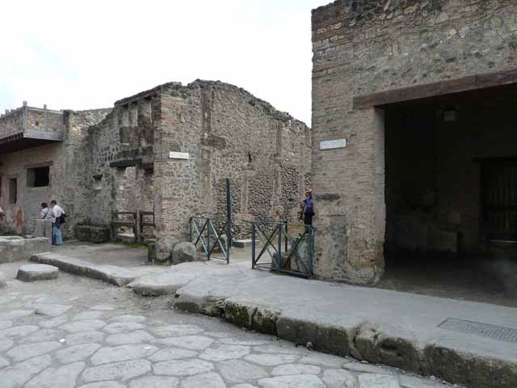 Via dell’Abbondanza, south side. May 2010. Looking towards junction with Vicolo della Nave Europa, between I.12 and I.11.
