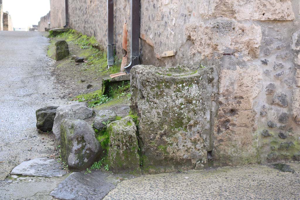 Vicolo della Nave Europa between I.12 and I.11. December 2018. 
Street altar against north-east corner of I.11, against east wall of I.11.7. Photo courtesy of Aude Durand.

