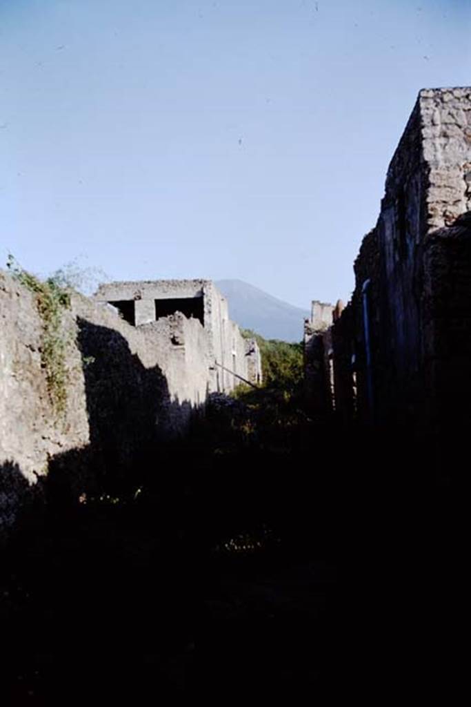 Vicolo della Nave Europa between I.11 and I.12, Pompeii. 1964. Looking north. 
Photo by Stanley A. Jashemski.
Source: The Wilhelmina and Stanley A. Jashemski archive in the University of Maryland Library, Special Collections (See collection page) and made available under the Creative Commons Attribution-Non Commercial License v.4. See Licence and use details.
J64f1513
