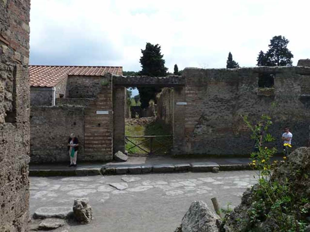 Via dellAbbondanza, south side. May 2010. Looking across junction to Vicolo della Venere, between II.3 and II.2