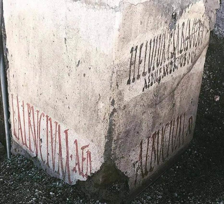 Vicolo delle Nozze Argento, at junction with Vicolo dei Balconi. Three electoral inscriptions at north-west corner of junction.

On the East wall are two inscriptions:

In black above is the inscription

HELVIUM SABINUM
AEDILEM D R P V B O V F

Helvium Sabinum
aedilem d(ignum) r(ei) p(ublicae)
v(irum) b(onum) o(ro) v(os)
f(aciatis)

In red below is the inscription:

ALBVCIVM AED

Electoral inscription on the south wall: 

L ALBVCIVM AED

L(ucium) Albucium aed(ilem). 

The Albucii were probably the owners of the House of the Silver Wedding.
The inscriptions were made on a layer of white paint, perhaps done to cover previous inscriptions and in any case to ensure a clear writing surface for the preserved inscriptions, which refer to the last electoral campaign of Pompeii before 79AD.
Photograph © Parco Archeologico di Pompei.