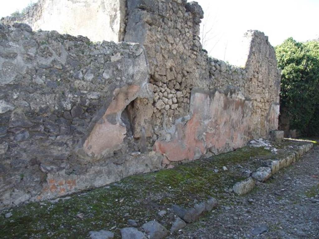 Vicolo di Lucrezio Frontone. March 2009. West side, front façade between doorways to V.3.10 and V.3.11.
Looking north towards V.3.11. 
