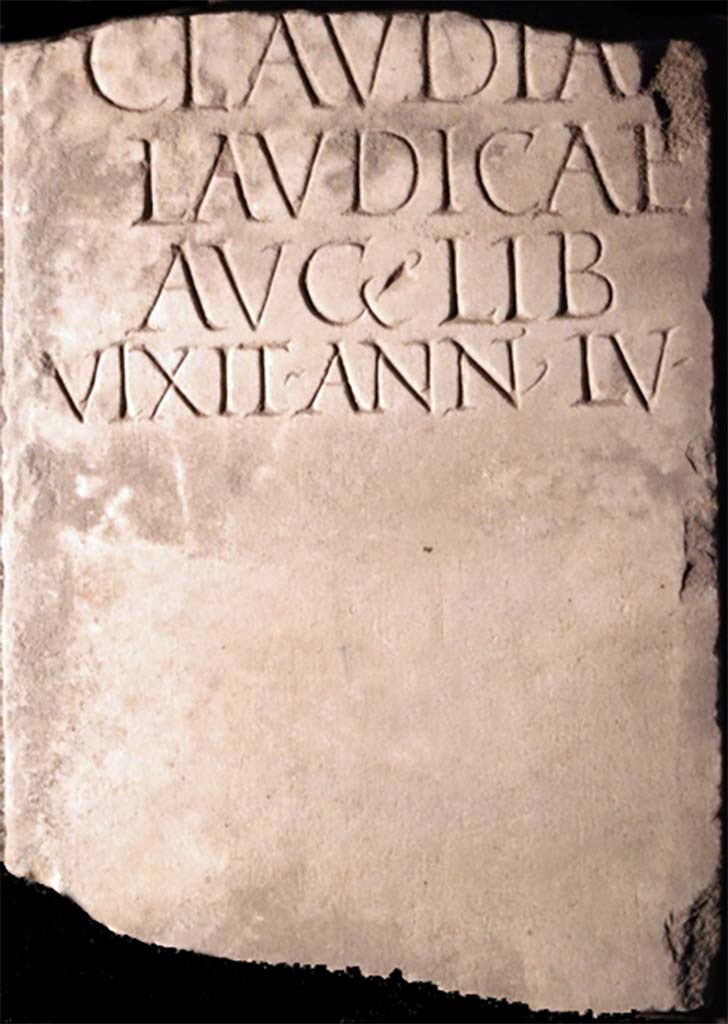 Pompei, Tombe presso la Strada Regia. Found in 1883 or a little earlier. Marble columella of Claudiae Laudicae.
Now in Naples Archaeological Museum. Inventory number 123256.
It was 1m high and 0.26m wide, broken at the top and with a circular hole towards the base.
According to Mau, it was found in the Fondo Santilli, around 1883 or a little earlier, more towards the city, immediately south of the road, at the meeting point of the old and the new road.  It may have been from a monument on the opposite side of the ancient road, facing the tomb now discovered.
See Mittheilungen des Kaiserlich Deutschen Archaeologischen Instituts, Roemische Abtheilung, 1894, p. 65.
It bore an inscription already published by Novi and reproduced in Ephemeris Epigraphica. Sogliano published it again and confirmed its authenticity and noted that the manuscript copy of Novi was not exact in the distribution of the lines.
See Ephemeris Epigraphica, Vol. VIII, 1899, p. 87, no. 319.

CLAVDIAE
LAVDICAE
AVG  LIB
VIXIT  ANN  LV 

Claudiae
Laudicae
Aug(usti) lib(ertae)
vixit ann(is) LV

Burial of a freedwoman.
See Notizie degli Scavi di Antichit, 1893, p. 334 no. 13.

Cooley translates this as 

To Claudia Laudica, freedwoman of Augustus. Lived 55 years.       [EE VIII no. 319]

See Cooley, A. and M.G.L., 2004. Pompeii: A Sourcebook. London: Routledge, G35, p. 148.
