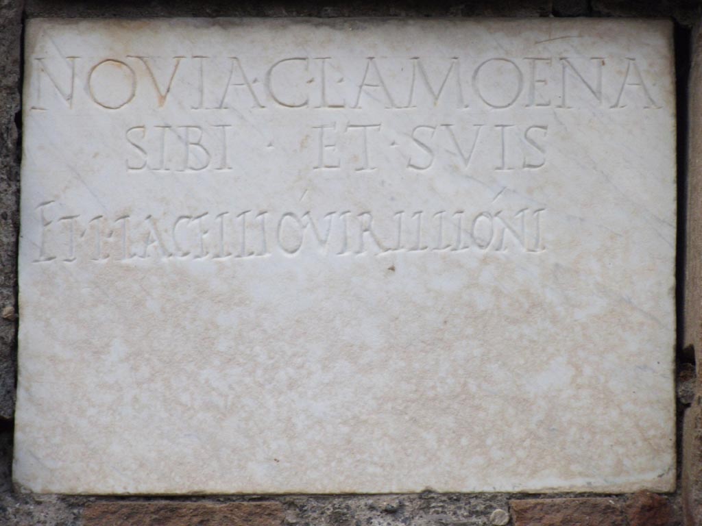 FPNE Pompeii. August 2011. Marble plaque in centre of tile pilaster in tomb. Photo courtesy of Peter Gurney.