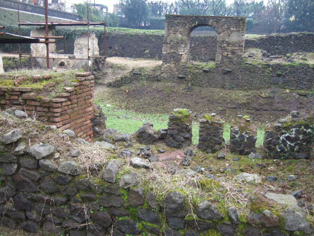 FPNE Pompeii. December 2005. Looking south from north side of tomb. The arches of tombs FPSG and FPSE can be seen on the south side of the roadway.