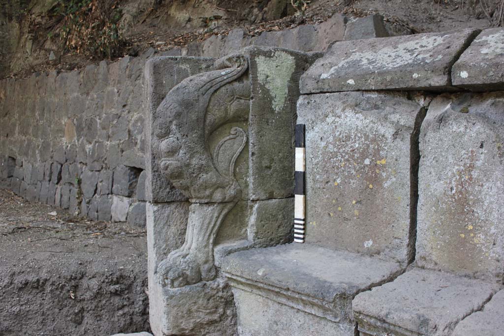 NGH Pompeii. August 2015. End of tomb schola with carved leg and paw. Photo courtesy Stephen Kay, British School at Rome.