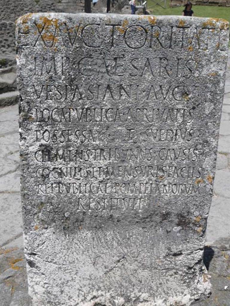 Pompeii Porta Nocera. May 2012. South side of Cippus of Titus Suedius Clemens.
Photo courtesy of Buzz Ferebee. The Cippus has the Latin inscription:

Ex auctoritate 
imp(eratoris) Caesaris 
Vespasiani Aug(usti)
loca publica, a privatis
possessa T(itus) Suedius 
Clemens tribunus causis 
cognitis et mensuris factis 
rei publicae Pompeianorum 
restituit,  

By virtue of authority conferred upon him by the Emperor Vespasian Caesar Augustus, 
Titus Suedius Clemens, tribune, having investigated the facts and taken measurements,
restored to the citizens of Pompeii public places illegally appropriated by private persons.

Similar Cippi were found at the Porta Ercolano, Porta Marina and the Porta Vesuvio.
The wording rei publicae Pompeianorum on one of these, discovered in 1763, was the first positive identification that the site was Pompeii. 
Until then scholars had divided opinions on the city buried under Civit.  
Many, including the first official excavators, thought it was the ancient city of Stabiae.
See Conticello, B., Ed, 1990. Rediscovering Pompeii. Rome: LErma di Bretschneider. (p. 225).

