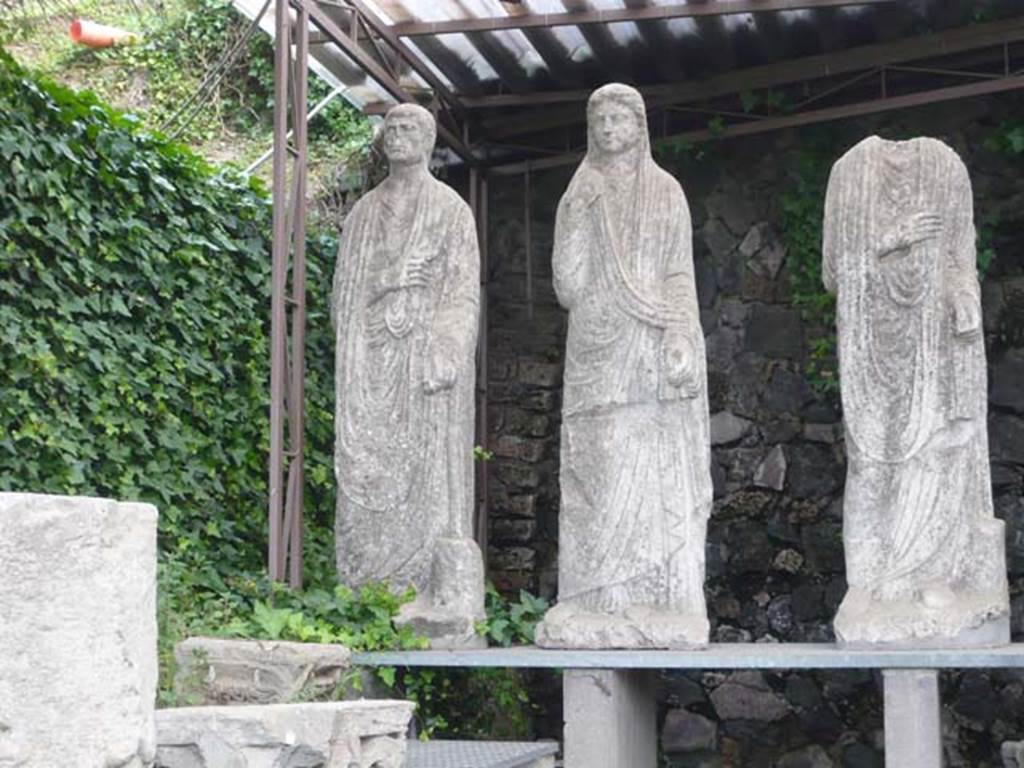 Pompeii Porta Nocera. Tomb 34aEN. May 2011. 
Three statues from tomb 34aEN now in display area between tombs OS and ES. 
Photo courtesy of Buzz Ferebee.
