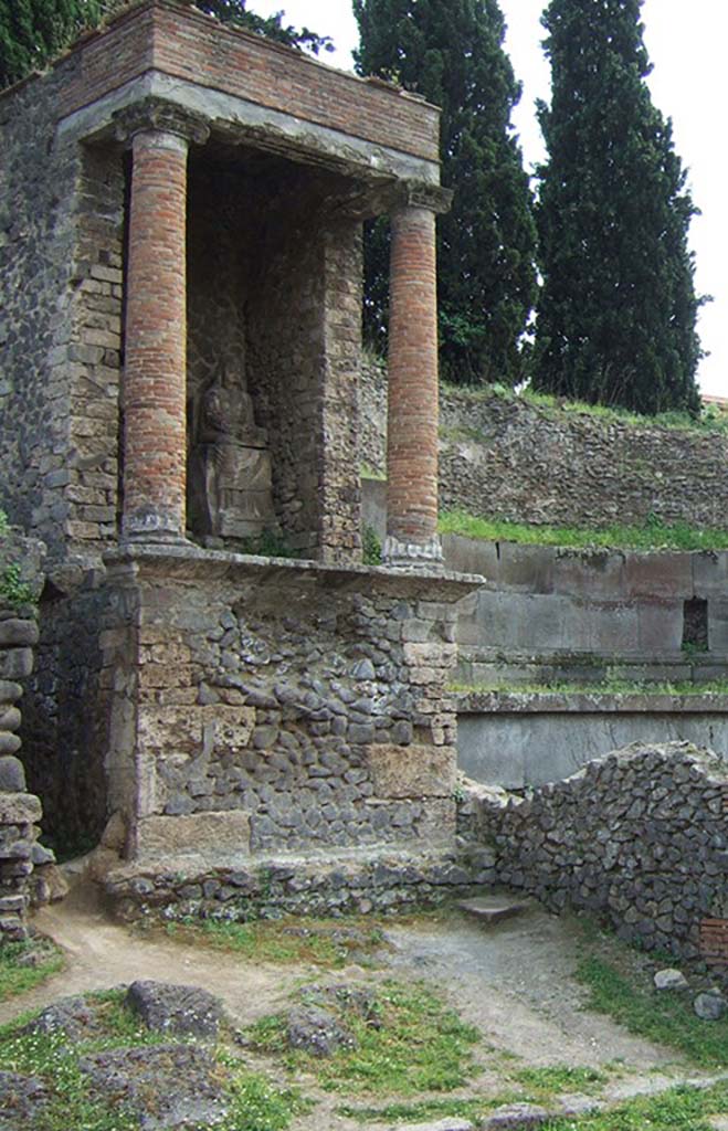 Pompeii Porta Nocera. May 2006. Tomb 9OS. Tomb of a magistrate? 
View from east side showing female seated figure.
