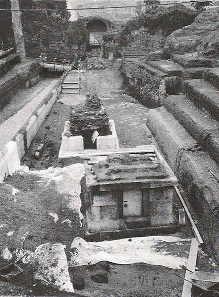 SG4 Pompeii. 2001. Tomb SG4 at rear and tomb SG5 at front, with Porta Stabia in the background.
According to Campbell, the tomb has a nearly square podium base constructed of a single course of limestone blocks, 0.71 metres high.
This is on top of a moulded base with lava superstructure that bears some resemblance to the stepped format of an altar tomb.
It was found to be heavily damaged on excavation.
There was a vaulted chamber with two small stone benches at base of walls that contain niches with funerary urns.
There were traces of simple painted decoration on stucco on vault.
The construction type, the stepped nature of the superstructure suggests an altar tomb of mid to late 1st century AD.
See Campbell V.L., 2014. The Tombs of Pompeii: Organization, Space, and Society. Routledge: Abingdon UK, p. 303-4.

The continuation of the Via Stabiana out from the city was lined with a wall, with a top capping, in a careful opus reticulatum work, dressed in white plaster, largely preserved.
On the left in the photo is the wall in opus incertum lining the road.
See D’Ambrosio A., 2001-2. Rivista di Studi Pompeiani XII-XIII, p. 220 fig. 1
See D’Ambrosio A., 2003. Rivista di Studi Pompeiani XIV, p. 287.
