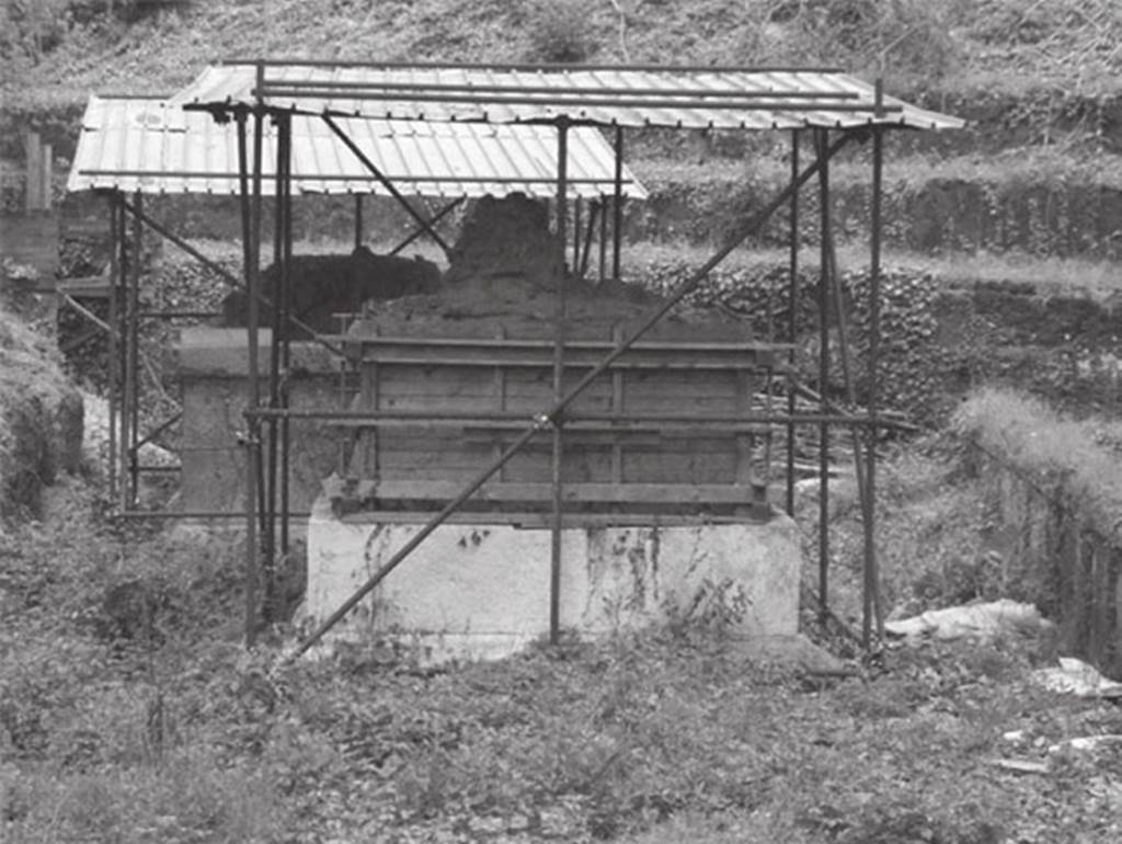 SG4 Pompeii. 2002. Tomb SG4 with tomb SG5 at rear.
The superstructure of the tomb was so badly damaged that it has been boxed into a wooden frame and covered with scaffolding.
The tomb chamber is not accessible as a result.
See Campbell V.L., 2014. The Tombs of Pompeii: Organization, Space, and Society. Routledge: Abingdon UK, p. 303-4.
