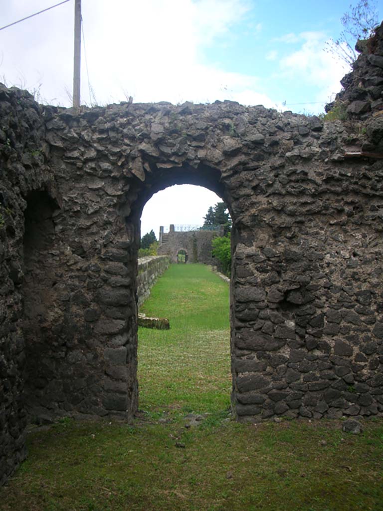 Tower X, Pompeii. May 2010. West wall.
Doorway onto wall-walk in south-west corner of first floor, looking west to Tower XI.
Photo courtesy of Ivo van der Graaff.
