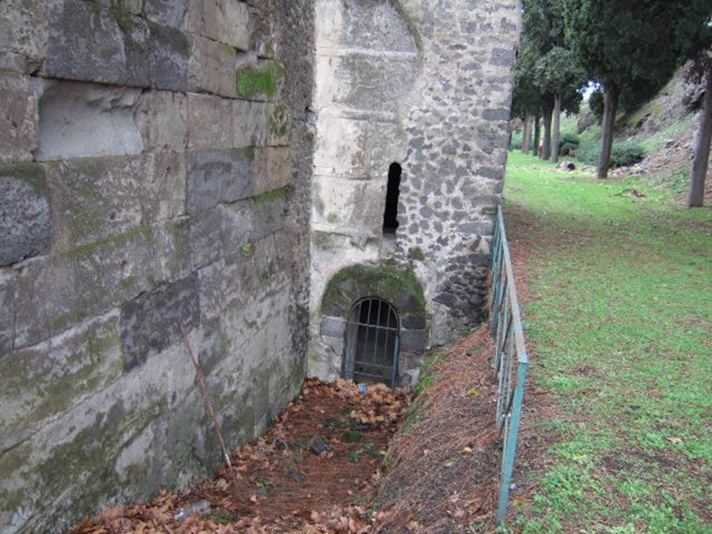 Tower X. Pompeii. December 2005. East side with arched postern doorway with arrow slit window above.

