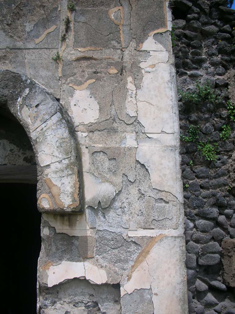 Tower X, Pompeii. May 2010. 
Detail of painted plaster on east side of doorway. Photo courtesy of Ivo van der Graaff.
