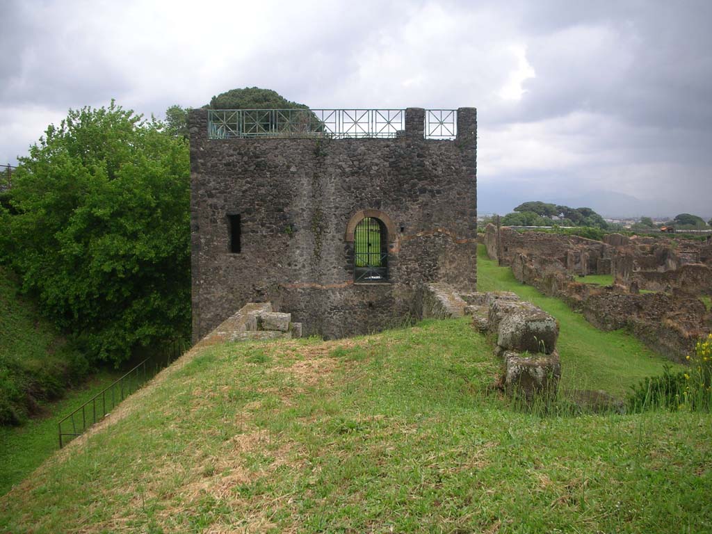 Tower XI, Pompeii. May 2010. Looking east towards Tower from top of walls on west side. Photo courtesy of Ivo van der Graaff.