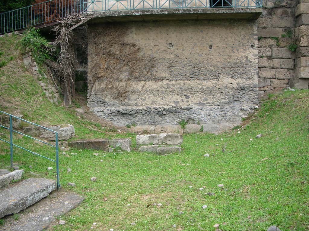 Tower XI, Pompeii. May 2010. Base of Tower on south side. Photo courtesy of Ivo van der Graaff.
According to Van der Graaff –
“The remains of two early gates have emerged: one sealed beneath Tower XI and the other at the current Porta Vesuvio. 
The Via di Mercurio, which has a dead end on the tower, may be an urban fossil of what was once a main artery to the Forum.” 
See Van der Graaff, I. (2018). The Fortifications of Pompeii and Ancient Italy. Routledge, (p.32 and Note 34). 
