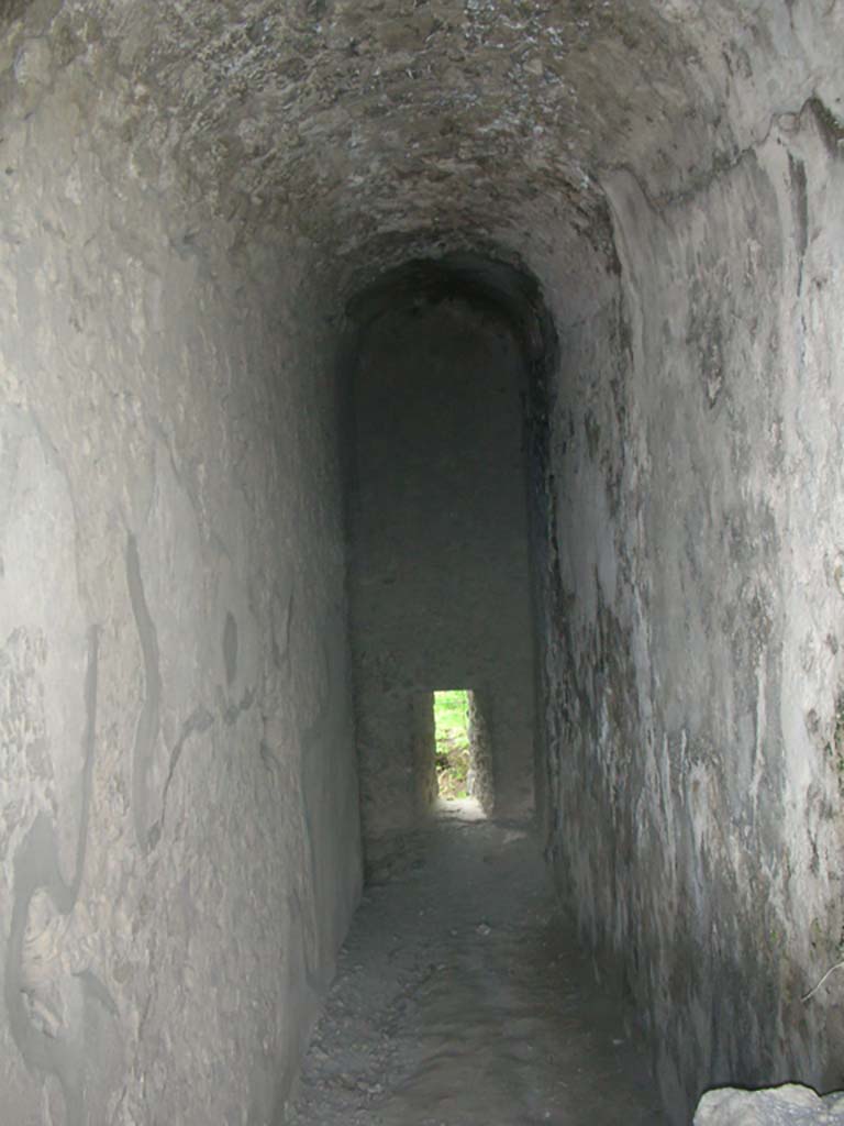 Tower XI, Pompeii. May 2010. 
North wall with arrow slit window in corridor/steps from entrance doorway. Photo courtesy of Ivo van der Graaff.
