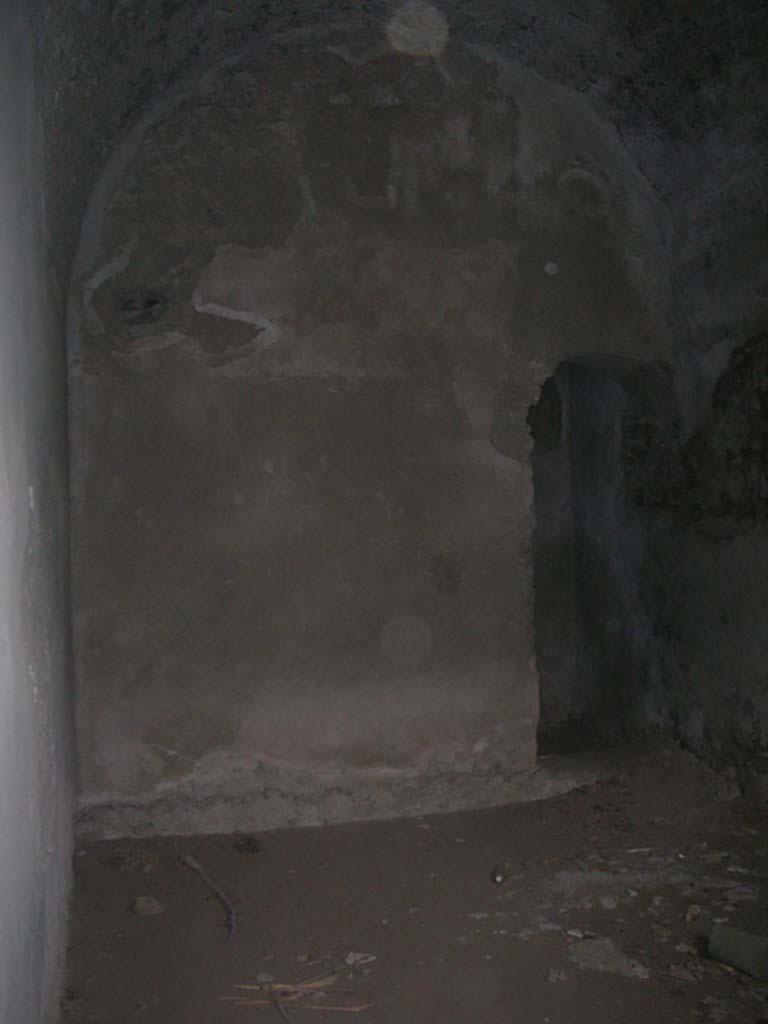 Tower XI, Pompeii. May 2010. 
South wall of lower room, with arched doorway, on right. Photo courtesy of Ivo van der Graaff.
