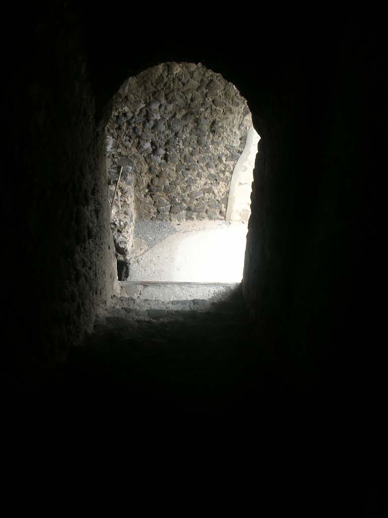 Tower XI, Pompeii. May 2010. 
Looking down steps from middle floor towards entrance doorway. Photo courtesy of Ivo van der Graaff.
