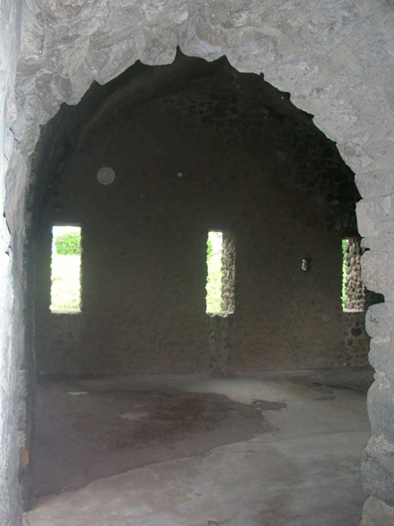 Tower XI, Pompeii. May 2010. 
Looking through arched doorway towards north wall of middle floor. Photo courtesy of Ivo van der Graaff.
