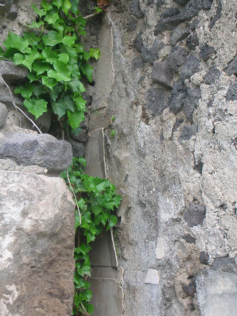 Tower XII, Pompeii. May 2010. 
Detail of remaining plaster on west side of tower. Photo courtesy of Ivo van der Graaff.
