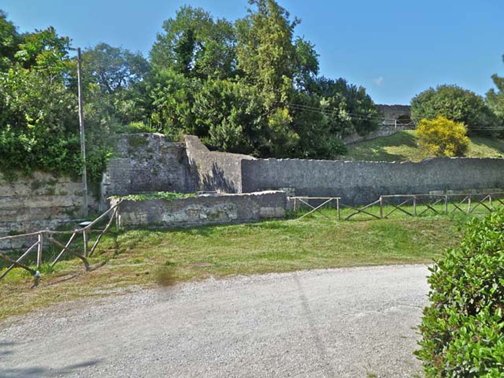 T4 Pompeii. Tower IV. May 2011. Front of tower with amphitheatre in background right. Photo courtesy of Michael Binns.