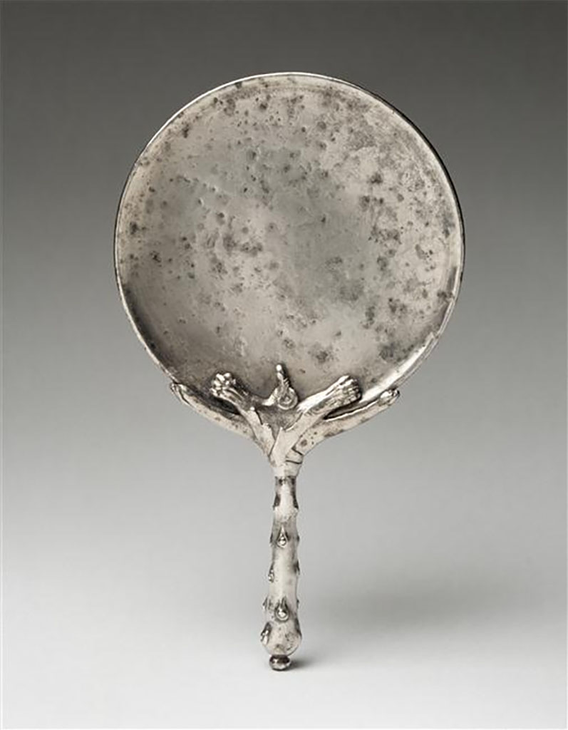 Villa della Pisanella, Boscoreale. A club handled mirror.
Handle attached to the mirror by a lion's skin. Polished disc.
Miroir  manche en forme de massue.
Manche rattach au miroir par une peau de lion. Disque poli.
Now in the Louvre, inventory number BJ2160. 
Photo  RMN-Grand Palais (muse du Louvre)/Herv Lewandowski.
