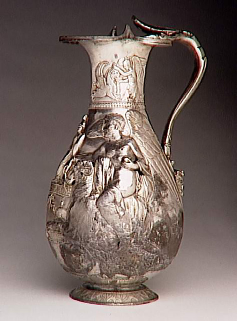 Villa della Pisanella, Boscoreale. Boscoreale Treasure. Oenochoe, silver wine vase with repousse decoration and traces of gilding. Height about 25 cm. Side 2.
On the neck: a winged genius gives water to a griffin. On the body: one victory on a ram, offers incense and an olive branch. Handle terminated at bottom with a head of Silenus crowned with ivy.

Oenocho du trsor de Boscoreale - Vase  vin en argent dcors repouss, traces de dorure. Hauteur environ 25 cm. Ct 2.
Sur le col : un gnie ail abreuvant un griffon. Sur la panse: une victoire sur un blier, offre de l'encens et un rameau d'olivier. Anse termin en bas par une tte de Silne couronne de lierre.
Photo  RMN-Grand Palais (muse du Louvre) / Herv Lewandowski.
Now in the Louvre, inventory number BJ 1898.
