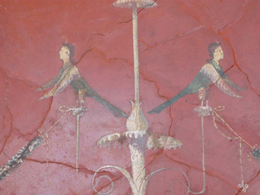 Villa of Agrippa Postumus, Boscotrecase. December 2010, Room 19, detail from centre of panel with candelabrum.
Photograph taken at Metropolitan Museum New York. Photo courtesy of Buzz Ferebee. 
