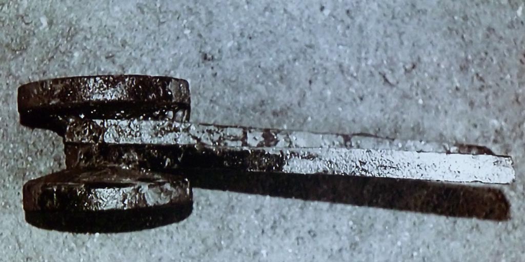 Complesso dei triclini in località Moregine a Pompei. September 2015. Triclinium, paired wheels from the lattice shutters that closed off the front of a triclinium.