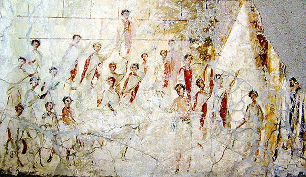 L’edificio B di Murecine a Pompei. Unit E, room 5b, upper floor south wall.
According to McManus, this shows Roman men wearing togae praetextae participating in a religious ceremony, probably the Compitalia.
PAP inventory number 85193. Photo courtesy of Barbara McManus, VRoma project.
According to Nappo this depicts the ceremony of souvetaurilia in front of the temple.
See Nappo, S. C., 2012.: Un esempio di architettura ricettiva alla foce del Sarno in Rivista di Studi Pompeiani XXIII, p. 98 no. 28.