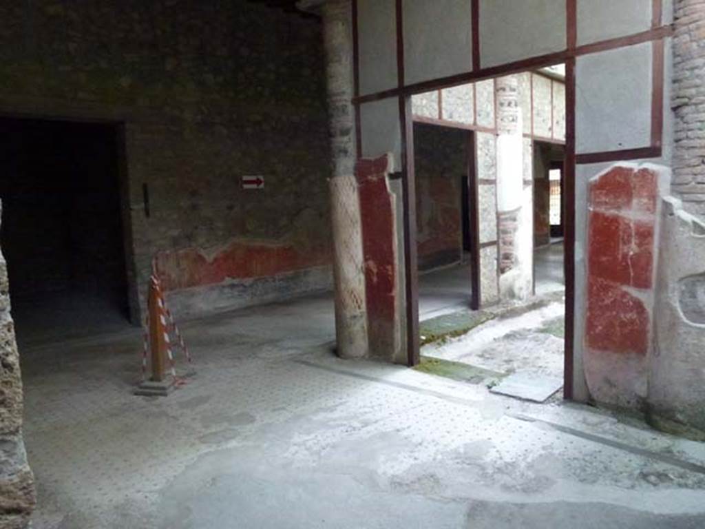 Oplontis, September 2011. Portico 24, looking east from near doorway to room 23.
The “doorway” between the columns, on the right, leads into the western part of peristyle 59. The doorway on the left is to room 25. Photo courtesy of Michael Binns.
