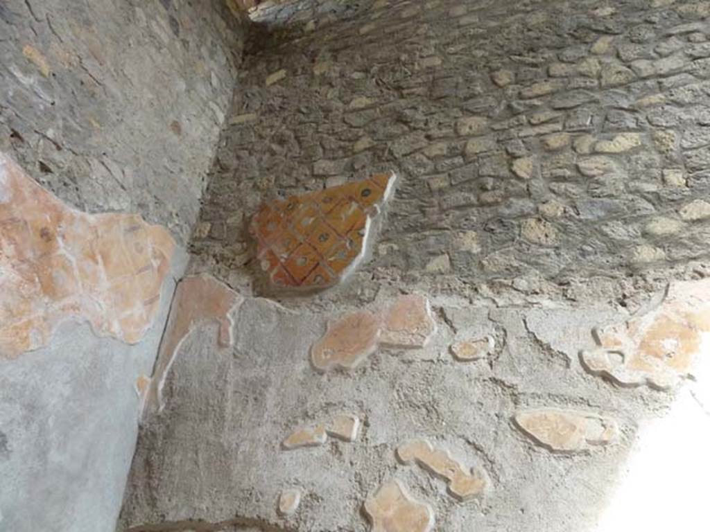 Oplontis, September 2015. Room 31, restoration of plaster on east wall, in north-east corner above doorway. 