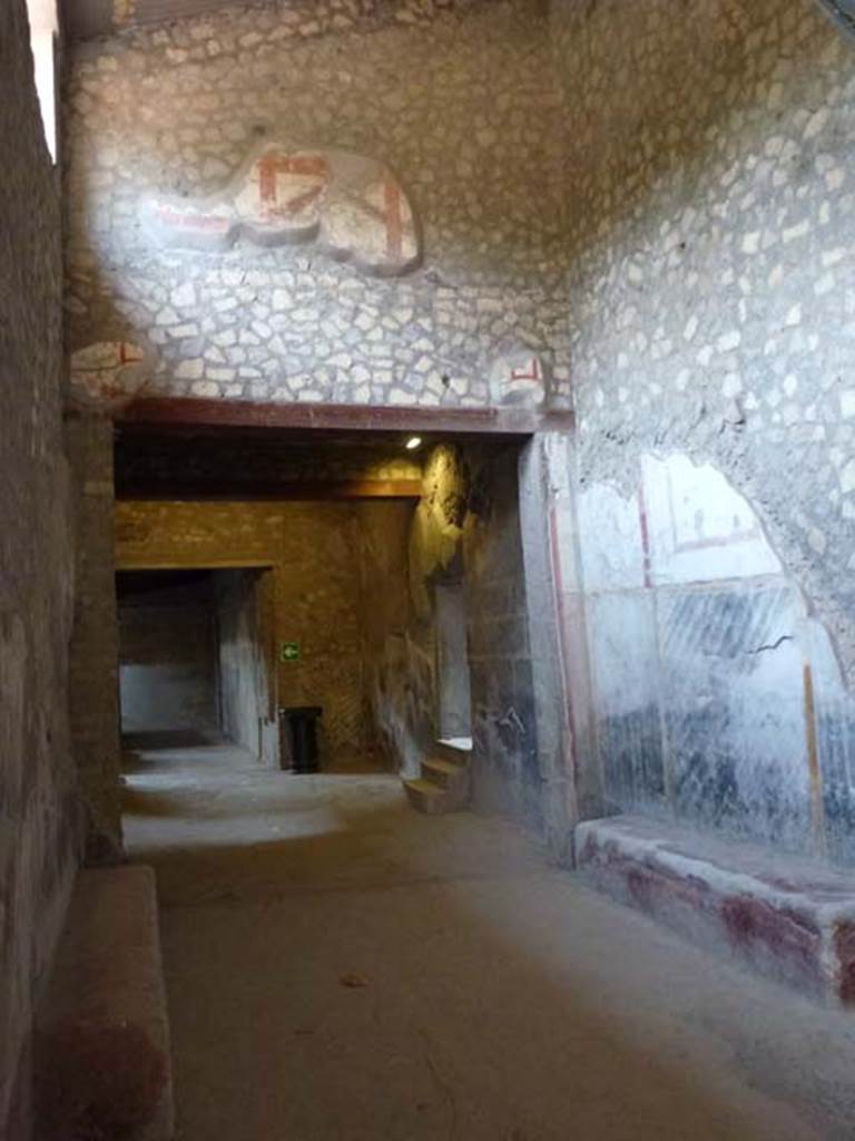 Oplontis, September 2011. Looking into room 45 from corridor 46, west end. Continuing ahead on the left is the north side of the internal courtyard/peristyle, 32.
The three steps on the right lead to the latrine area 48-50 and rooms beyond.
Photo courtesy of Michael Binns.

