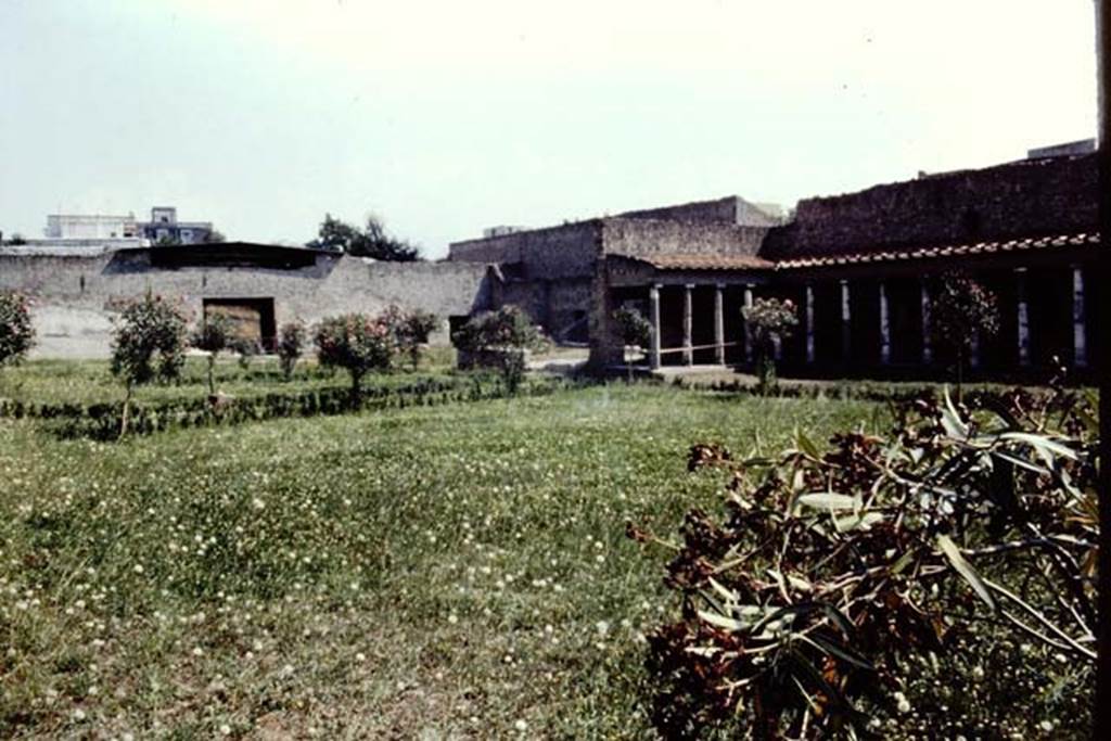 Oplontis Villa of Poppea, c.1983 or 1984. Looking south-east across north garden 56, towards east complex of rooms, with square doorway to exedra 69.
Source: The Wilhelmina and Stanley A. Jashemski archive in the University of Maryland Library, Special Collections (See collection page) and made available under the Creative Commons Attribution-Non Commercial License v.4. See Licence and use details.
Oplo0077   
