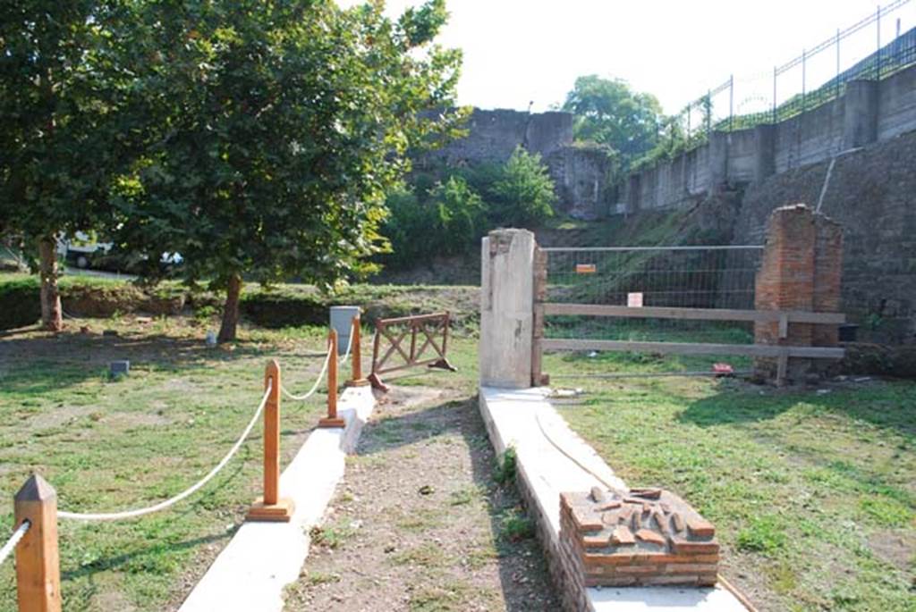 Oplontis Villa of Poppea, September 2009. Area 85 looking east along the path. 
Area 92 left (north) and area 86 right (south) of the image respectively.
Photo courtesy of Drew Baker - from the King's College London, Villa of Oplontis Archive.
