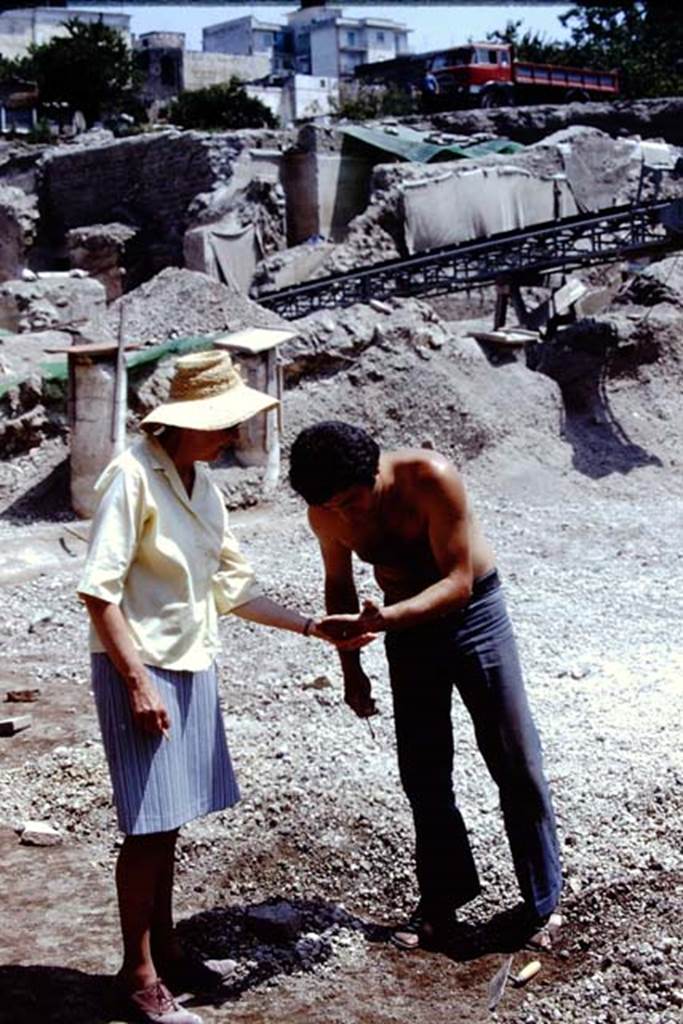 Oplontis Villa of Poppea, 1975 or 1974. A discovery in the lapilli ! Looking north-east to rear of area 59, the south-east peristyle. Photo by Stanley A. Jashemski.   
Source: The Wilhelmina and Stanley A. Jashemski archive in the University of Maryland Library, Special Collections (See collection page) and made available under the Creative Commons Attribution-Non Commercial License v.4. See Licence and use details. J74f0870
