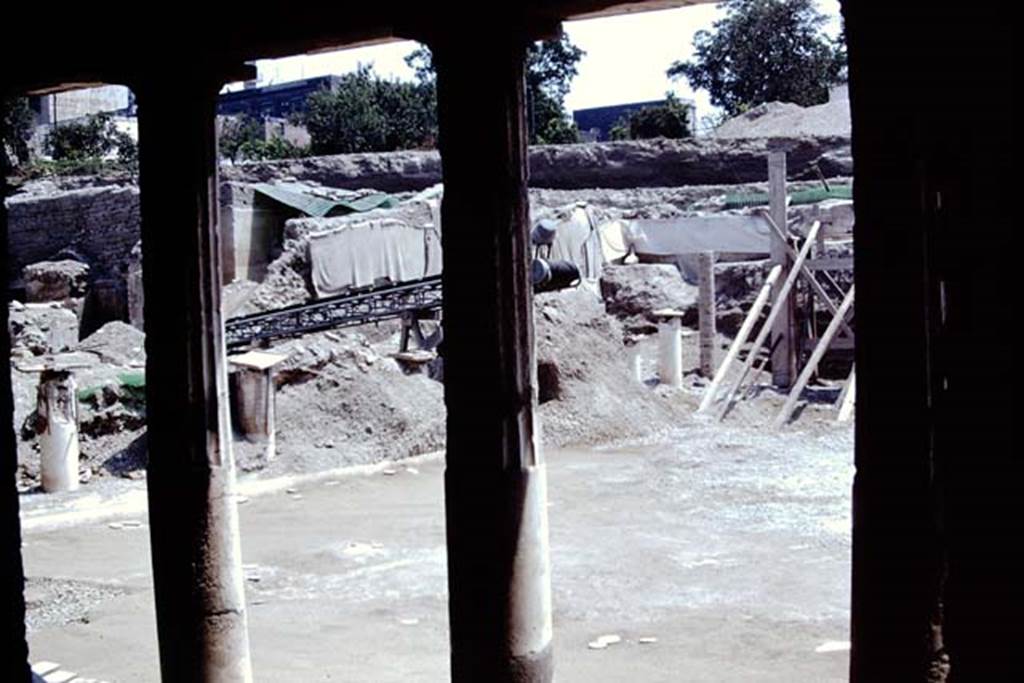 Oplontis, 1975. Looking north-east from behind the west portico of area 59, the south-east peristyle. Photo by Stanley A. Jashemski.   
Source: The Wilhelmina and Stanley A. Jashemski archive in the University of Maryland Library, Special Collections (See collection page) and made available under the Creative Commons Attribution-Non Commercial License v.4. See Licence and use details. J75f0483

