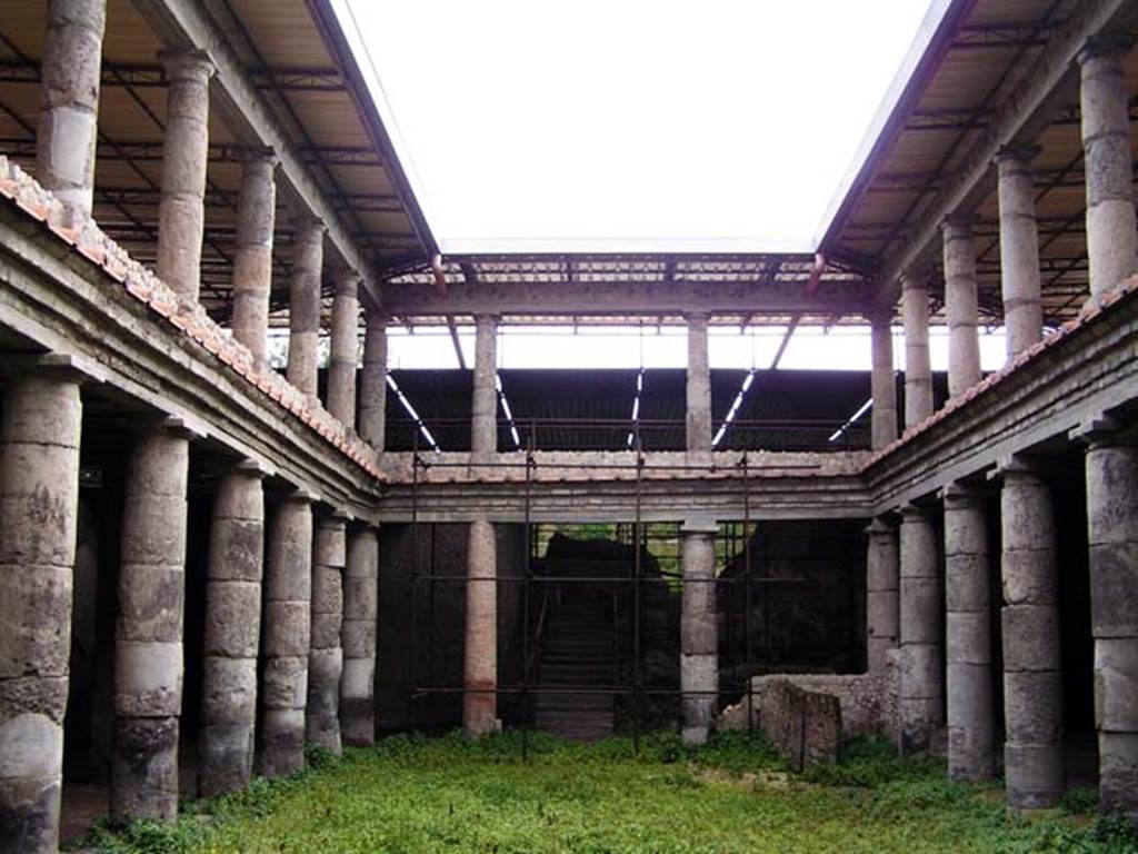 Oplontis, Villa L. Crassius Tertius. March 2005. Central courtyard 27 and two tier peristyle, looking east. 
Photo courtesy of Massimo Gravili.
