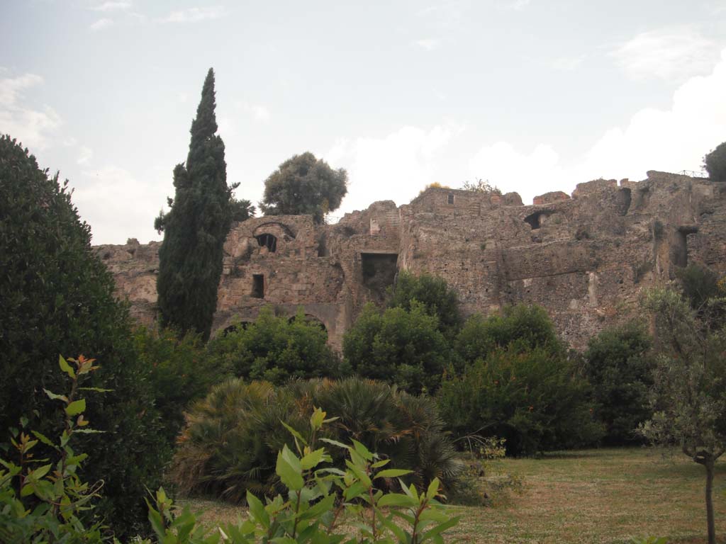 Pompeii south side, May 2011. 
Rear of houses in VIII.2.1, centre left, VIII.2.3, centre right, and lower floors of VIII.2.14-16 ?, on right. Photo courtesy of Ivo van der Graaff.
