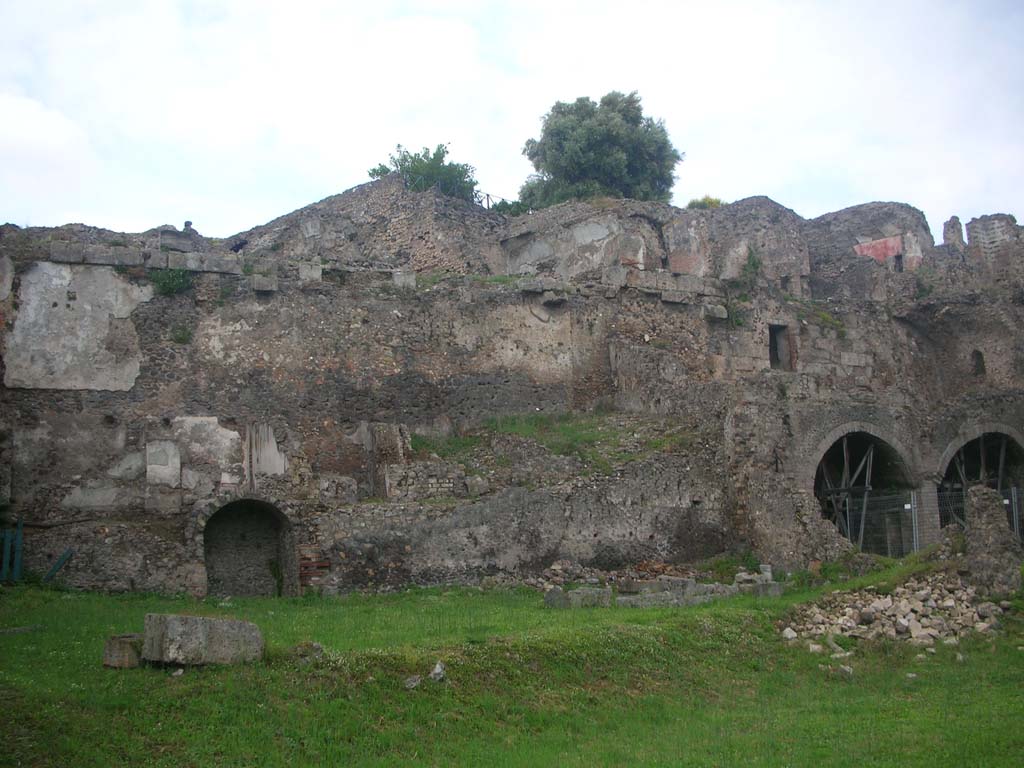 VIII.2.A, on left, with VIII.2.1, in centre, Pompeii. May 2010. Looking north towards rear. Photo courtesy of Ivo van der Graaff.