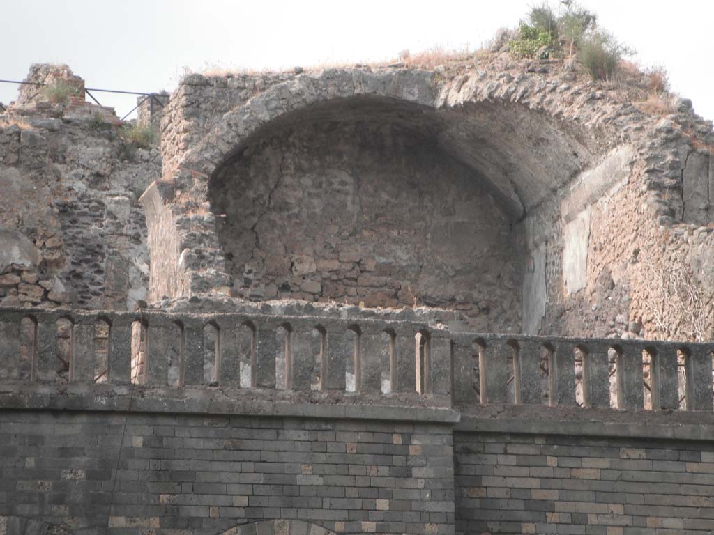 VIII.2.34 Pompeii. May 2011. 
Room ‘10’, looking north towards vaulted triclinium on lower level with detail of north wall. Photo courtesy of Ivo van der Graaff.
